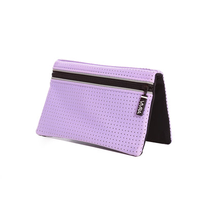 Bi-fold belt-less magnetic bum bag made of neoprene fabric in plain pastel purple block colour. Neoprene has a perforated sporty design aesthetic.  Waist bag contains 4 concealed magnets – one in each corner to secure to any waist band.