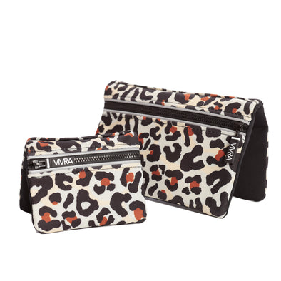 Bi-fold belt-less magnetic bum bag made of neoprene fabric in a leopard print.  Waist bag contains 4 concealed magnets – one in each corner to secure to any waist band.