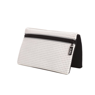 Bi-fold belt-less magnetic bum bag made of neoprene fabric in plain white block colour. Neoprene has a perforated sporty design aesthetic.  Waist bag contains 4 concealed magnets – one in each corner to secure to any waist band.