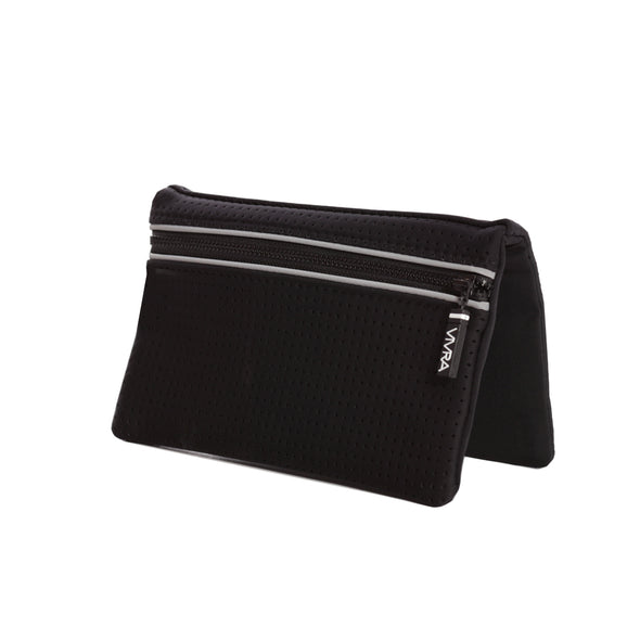 Bi-fold belt-less magnetic bum bag made of neoprene fabric in plain black block colour. Neoprene has a perforated sporty design aesthetic.  Waist bag contains 4 concealed magnets – one in each corner to secure to any waist band.
